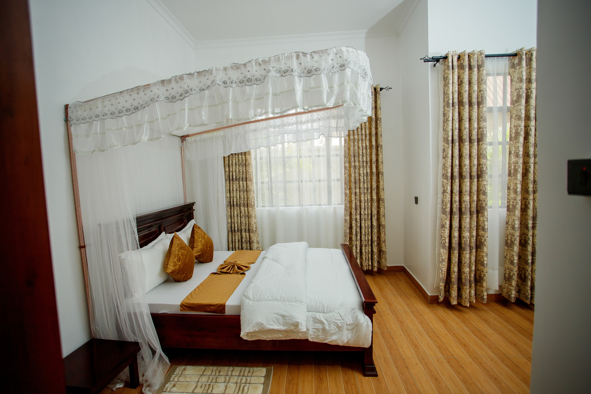 Elegant bedroom with mosquito net canopy
