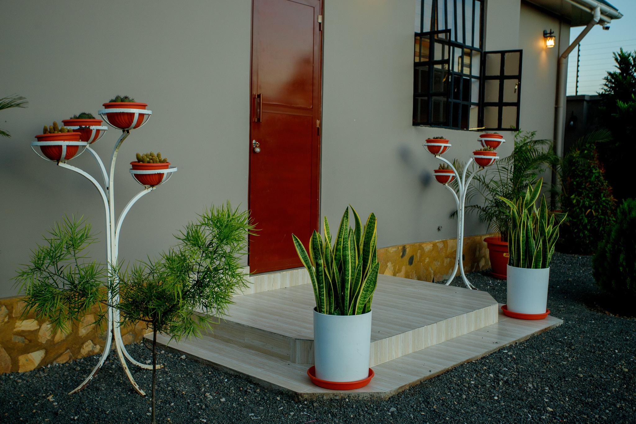 Beautiful entrance with decorative landscaping and planters