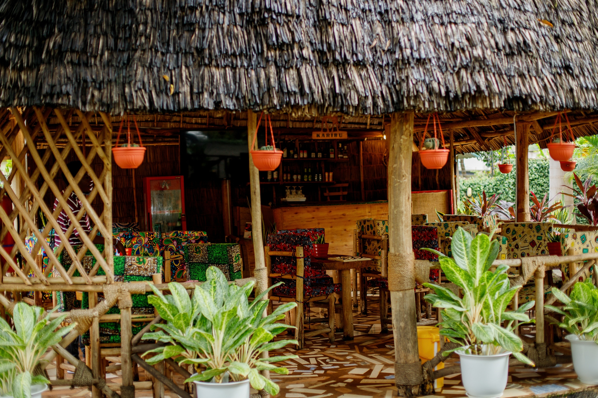 Traditional thatched-roof restaurant with African decor